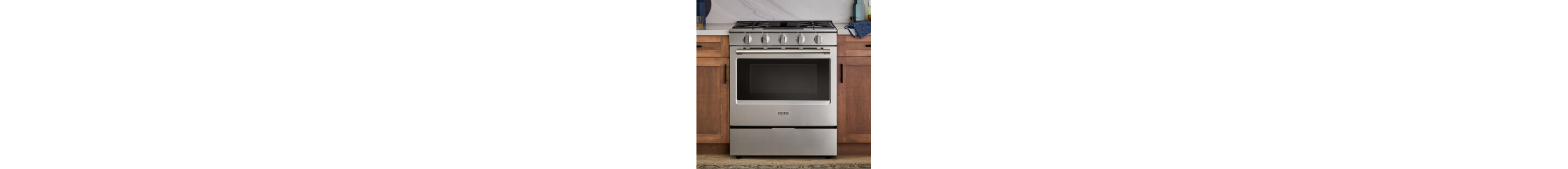 Kitchen range in brown cabinetry