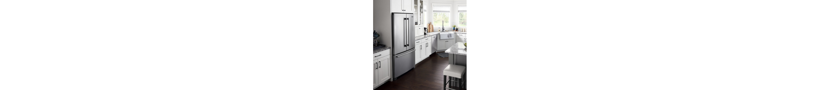 A stainless steel Maytag® refrigerator in a kitchen with white cabinets.