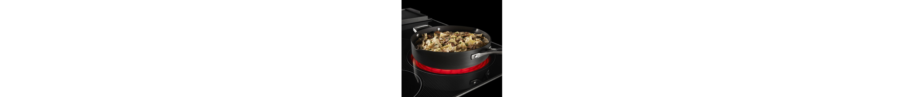 Chicken pasta cooking on an electric cooktop