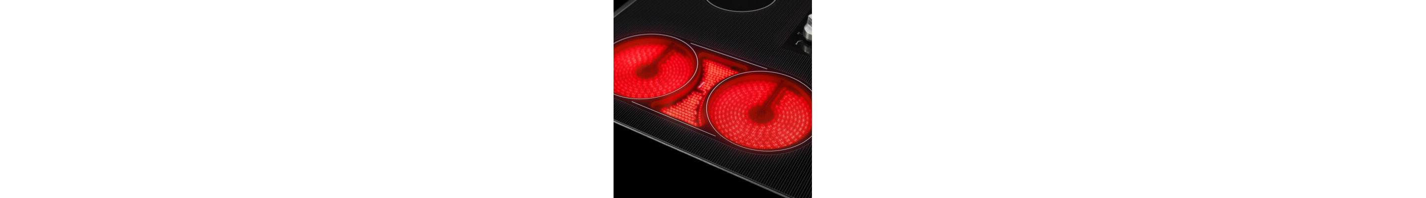 A close-up of a Maytag® electric cooktop with the burners on