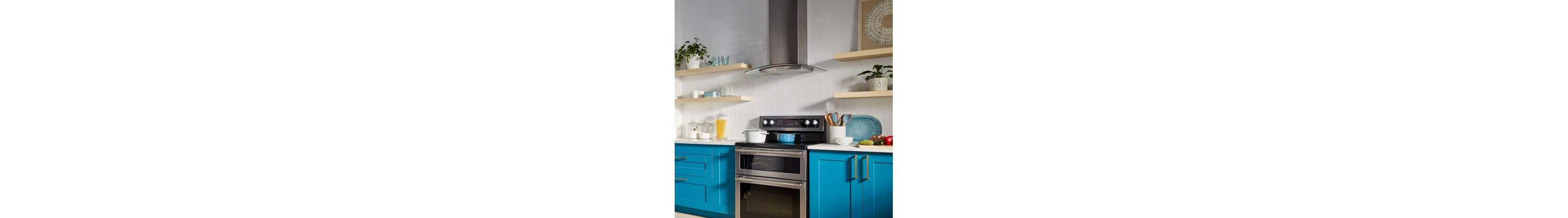 A Maytag® range hood over a stove in a modern kitchen