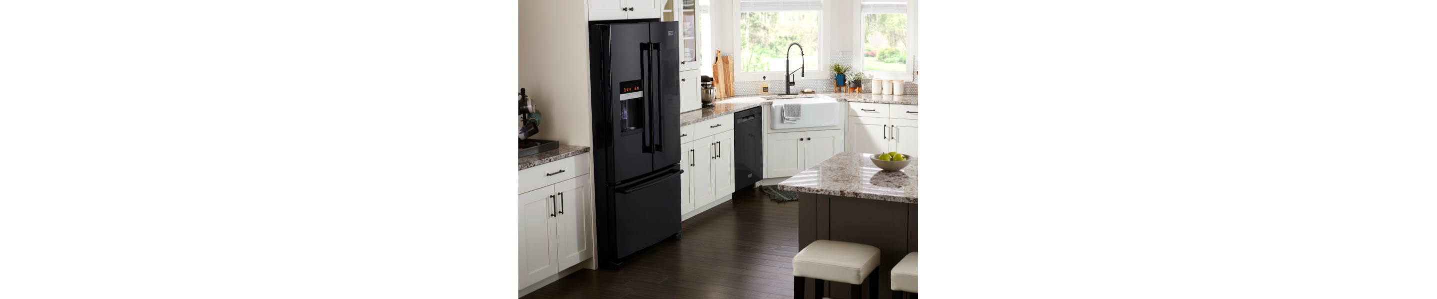 Modern kitchen featuring a black, French door refrigerator