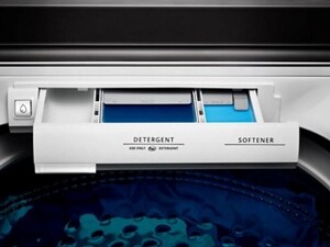 A close up of a Maytag® washer detergent dispenser