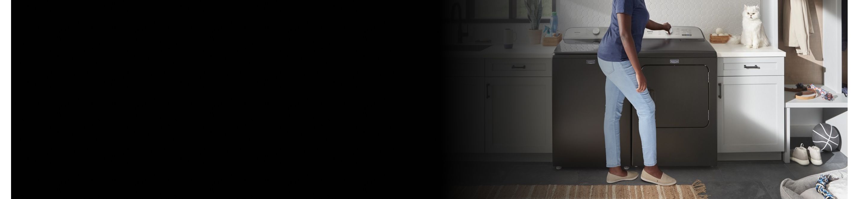 Person standing at a washing machine