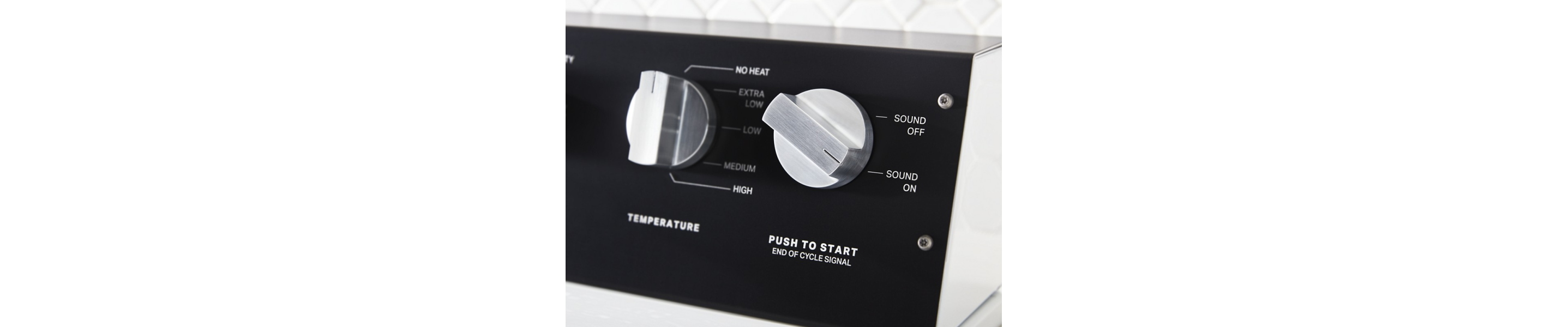 Close-up of dryer setting knobs