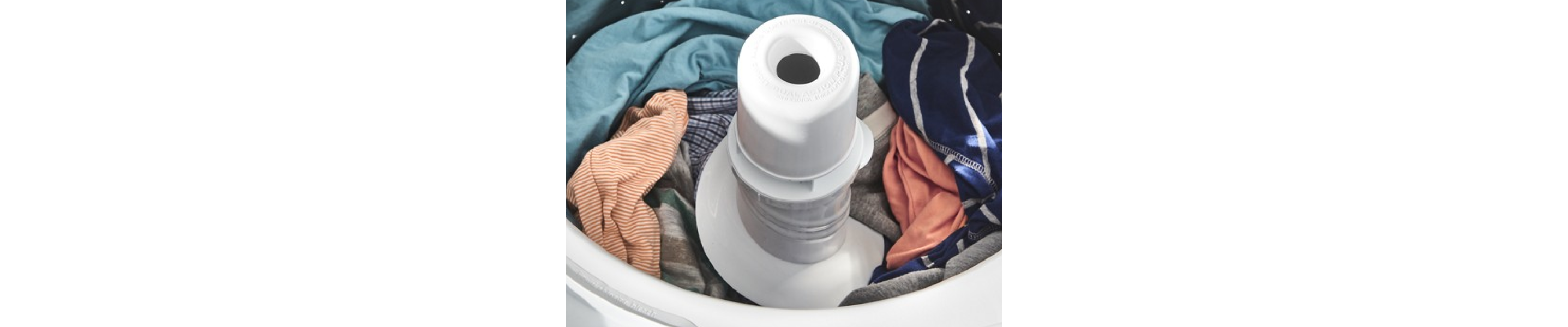 Assorted clothes tumbling in a dryer