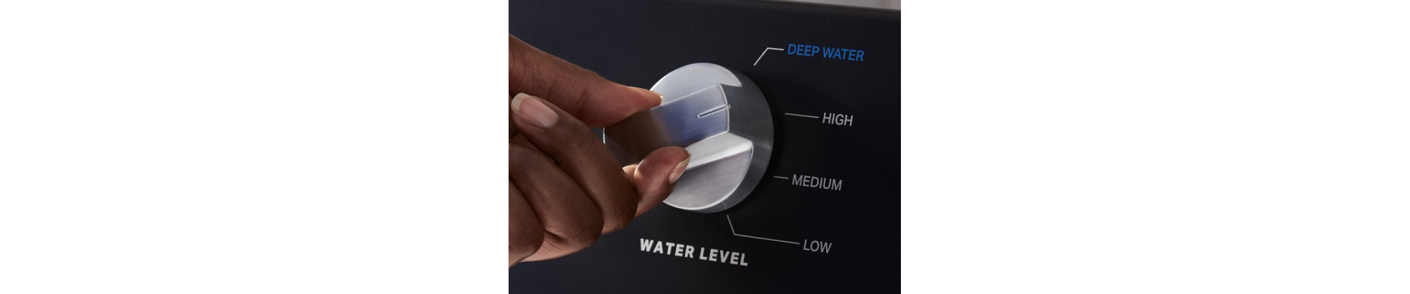 Close-up of a person selecting a cycle on a Maytag brand washer