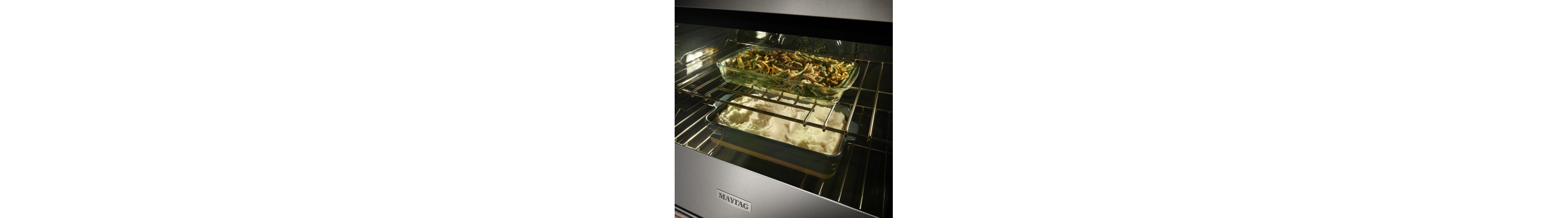 Two baking dishes inside an oven