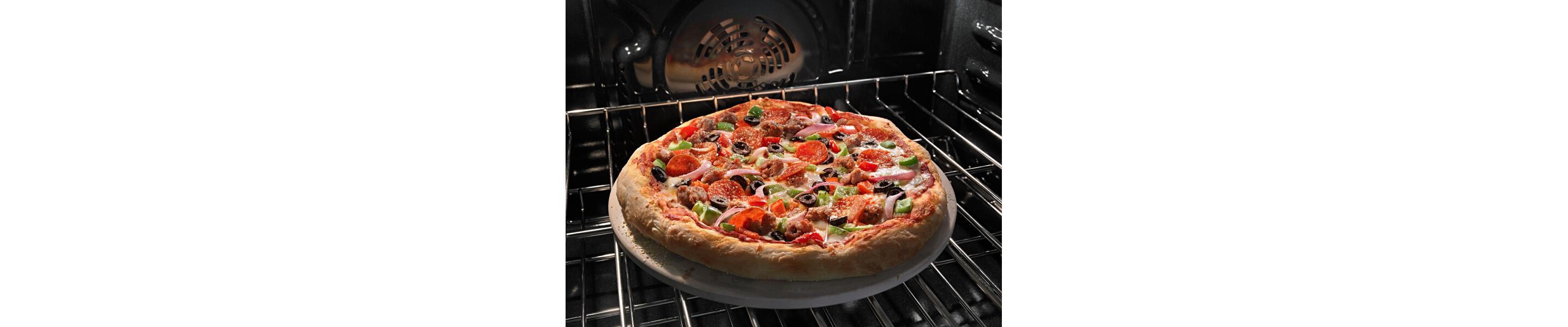 A pizza baking on an oven rack