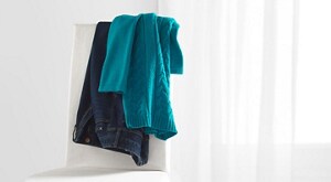 Clothes hanging on the back of a chair