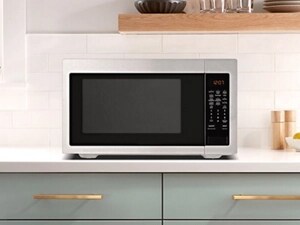 A microwave on top of a light-colored countertop
