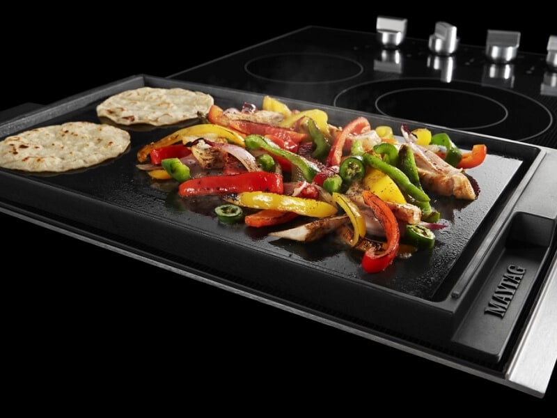 Vegetables and tortillas on a griddle pan
