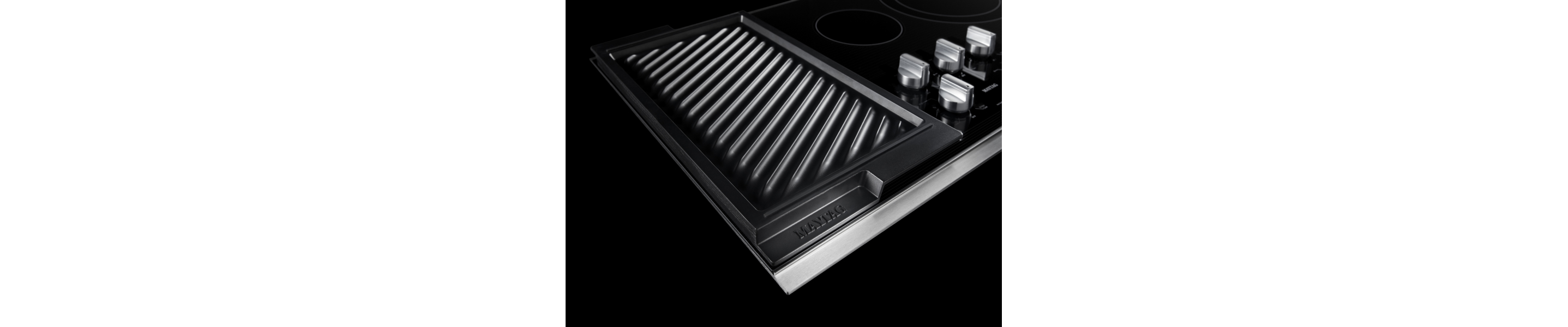 A Maytag® electric cooktop with reversible grill and griddle