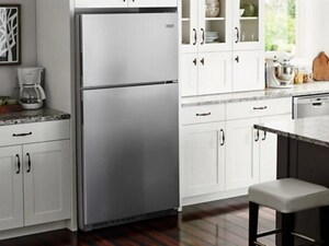 Maytag® top-freezer refrigerator in white cabinetry