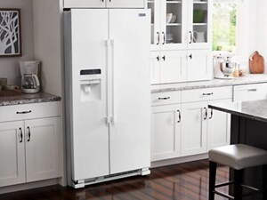 White Maytag® side-by-side refrigerator in white cabinetry