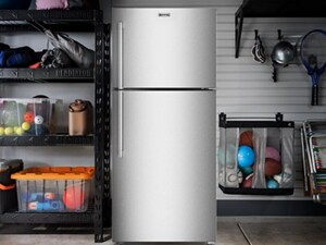 A top-freezer refrigerator in a garage