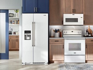 A kitchen with a white, side-by-side refrigerator