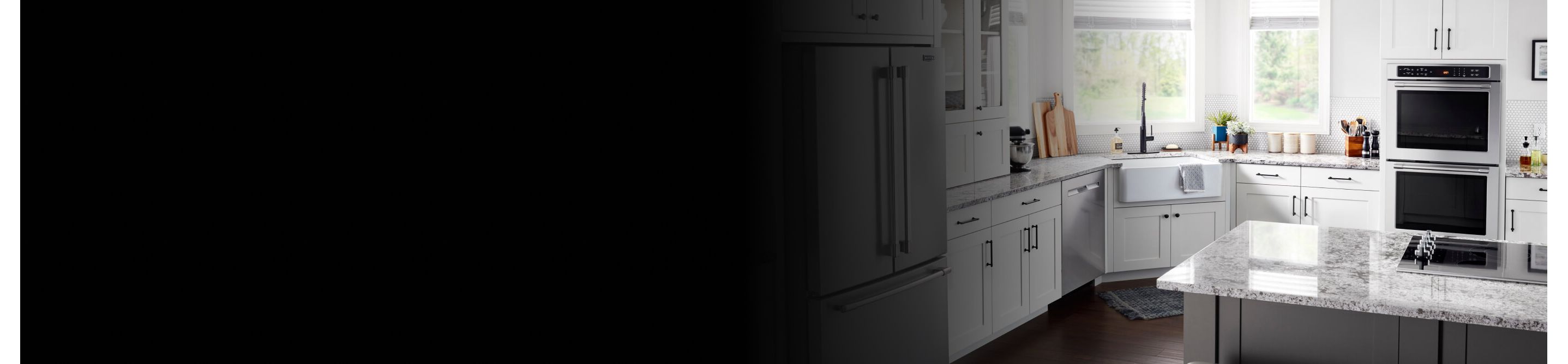 A Maytag® Double Wall Oven and cooktop in a modern kitchen