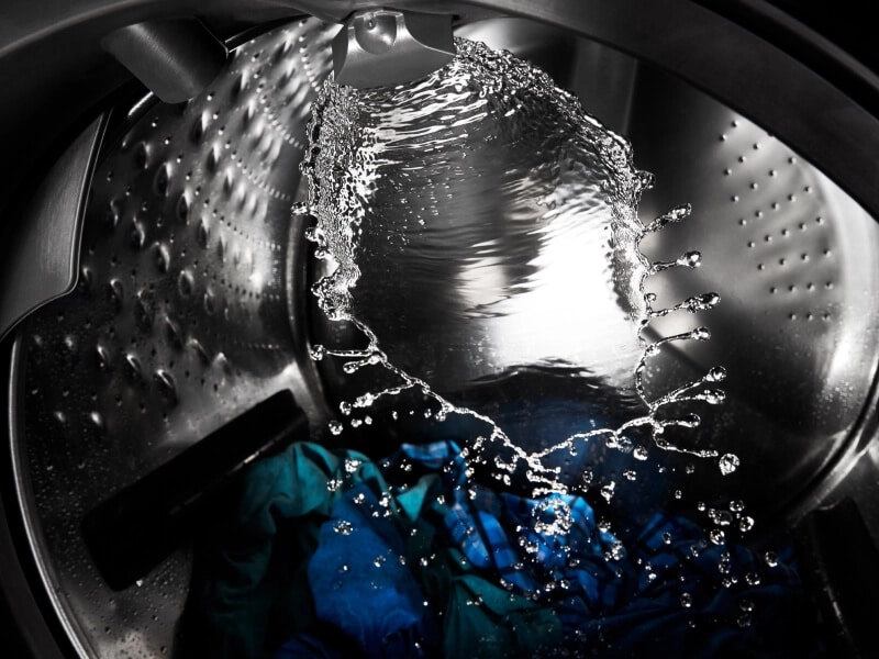 Water splashing around the inside of a washer drum