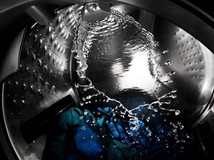 Water splashing around the inside of a washer drum
