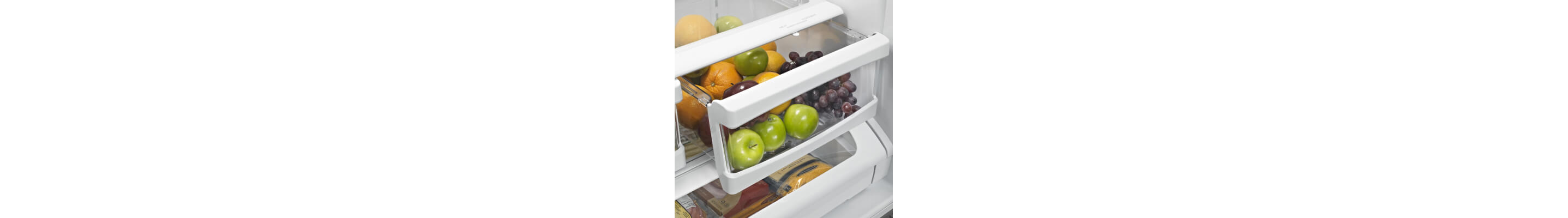 Produce in a cracked open crisper drawer
