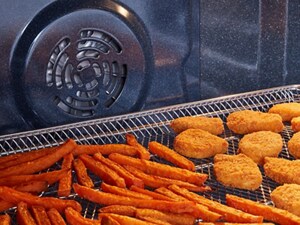 Chicken nuggets and fries in an air fry basket