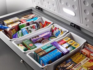 An open chest freezer with food inside