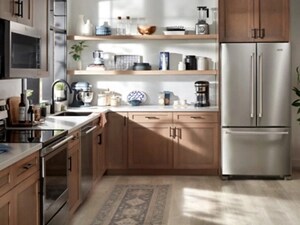 Maytag® French door refrigerator in modern kitchen with brown cabinetry