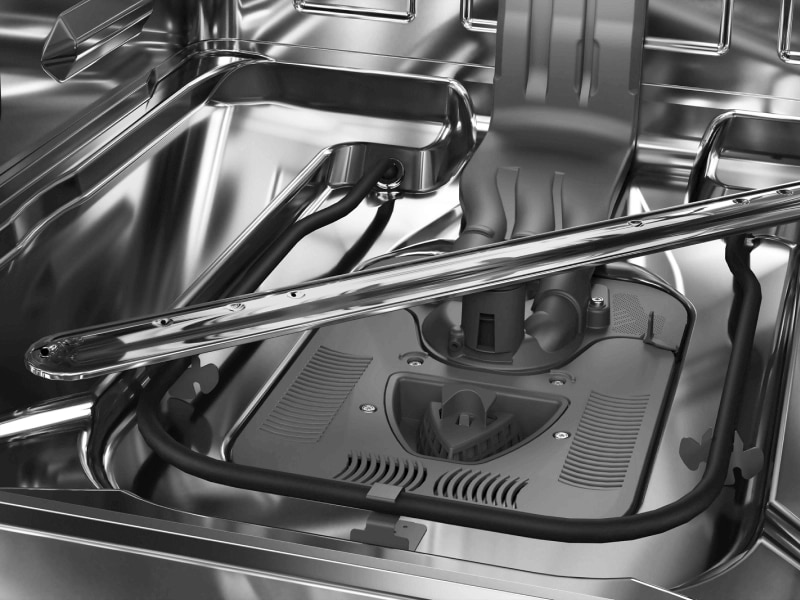 Close-up of dishwasher parts at the bottom of the tub