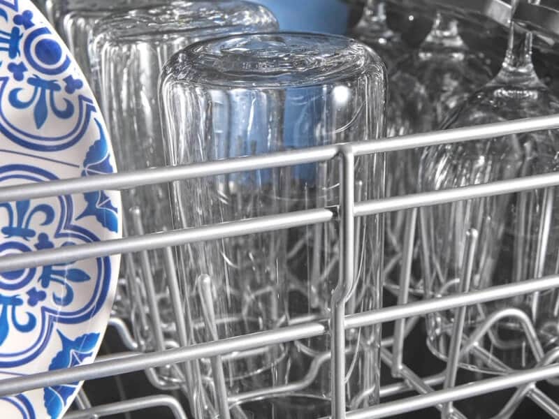 Clean dishes on a dishwasher rack