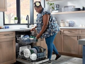 Person putting dishes on the top rack of a dishwasher