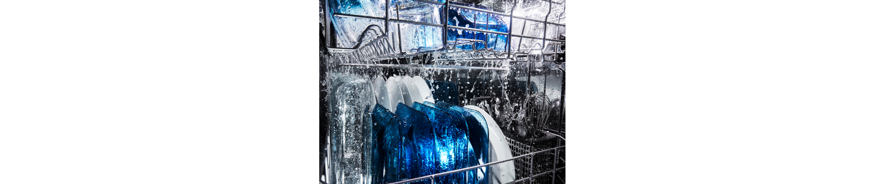 Water running on dishes in a dishwasher.