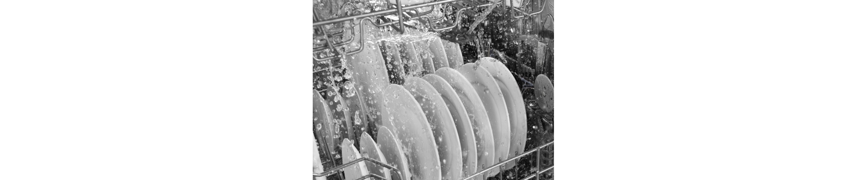 Water running over dishes in dishwasher