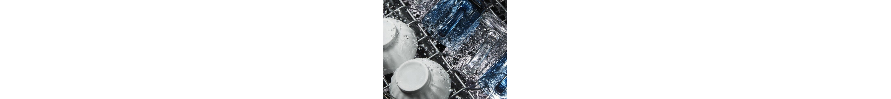 Water running over dishes in dishwasher
