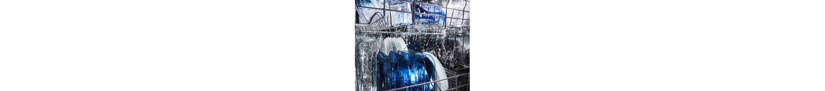 Water running over dishes in dishwasher