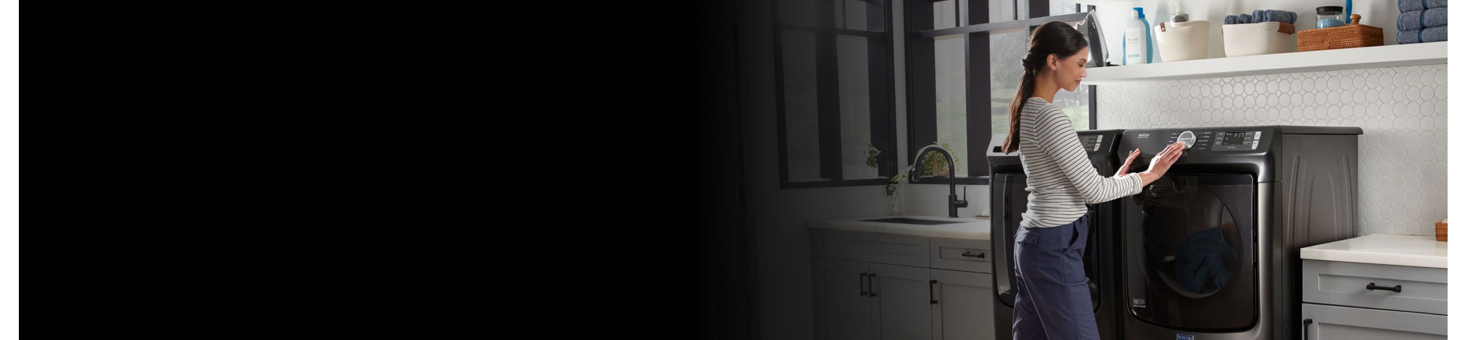 Person selecting a drying cycle on a Maytag® dryer