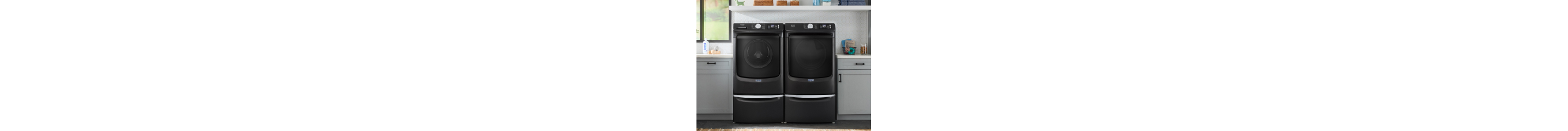 Front load washer and dryer on laundry pedestals
