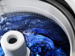 Clothes washing inside a top load washer with an agitator