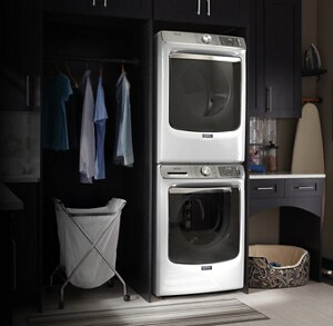 A stackable washer and dryer in a laundry room
