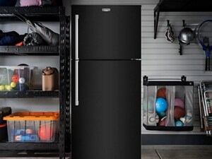 A Black Maytag® refrigerator in a garage