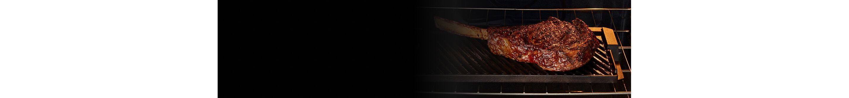 Steak grilling inside a Maytag® oven with Grill Mode
