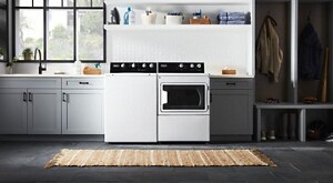 White top load Maytag® laundry pair in an open laundry room