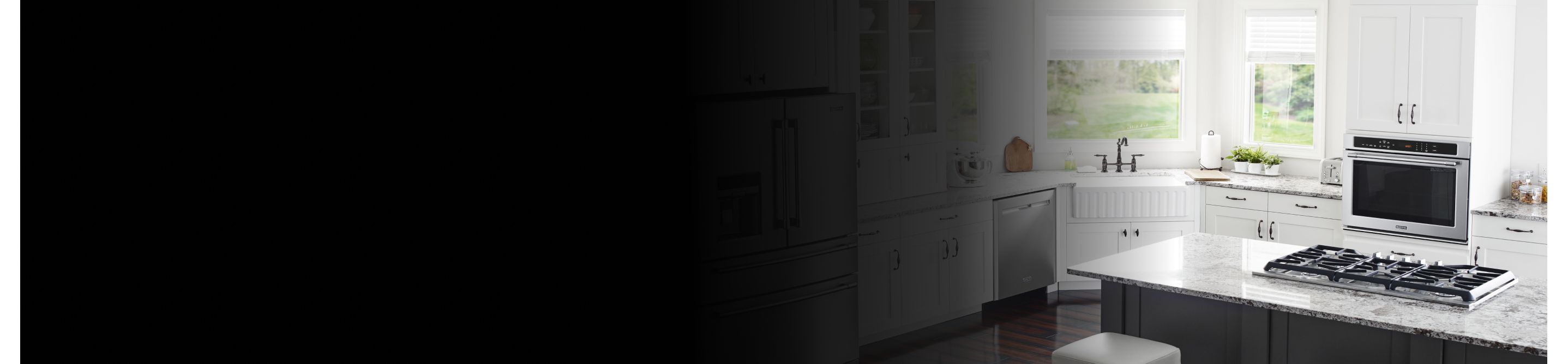 Interior overview of kitchen with gas range and wall oven.