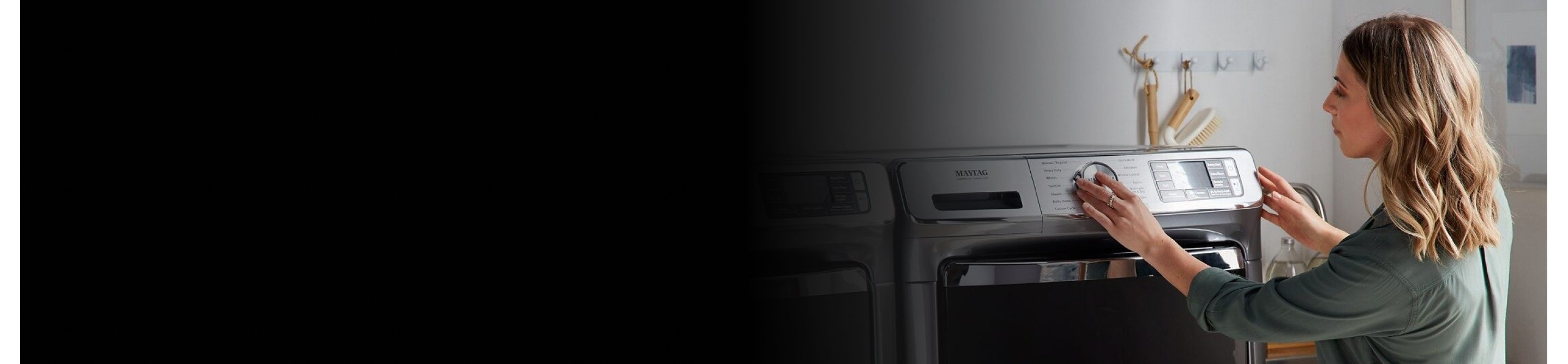 Person adjusting dryer settings
