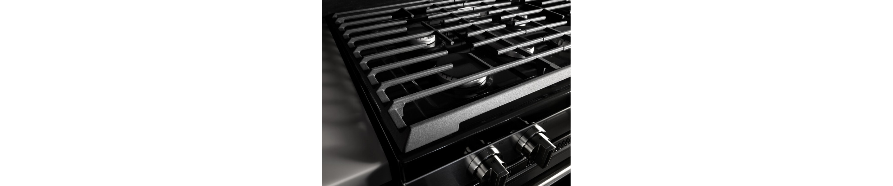 Close-up of iron grates on a gas cooktop