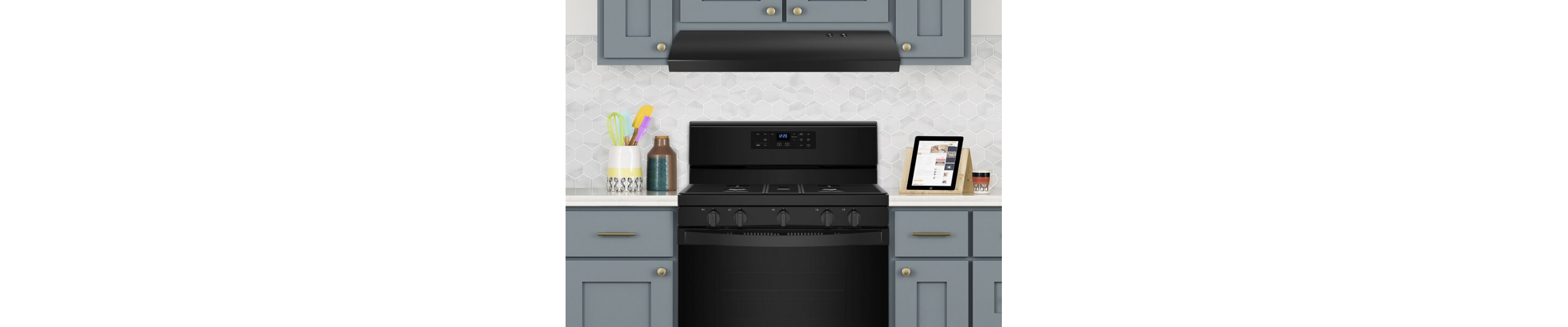 Under-canopy range hood above a black Maytag® gas range
