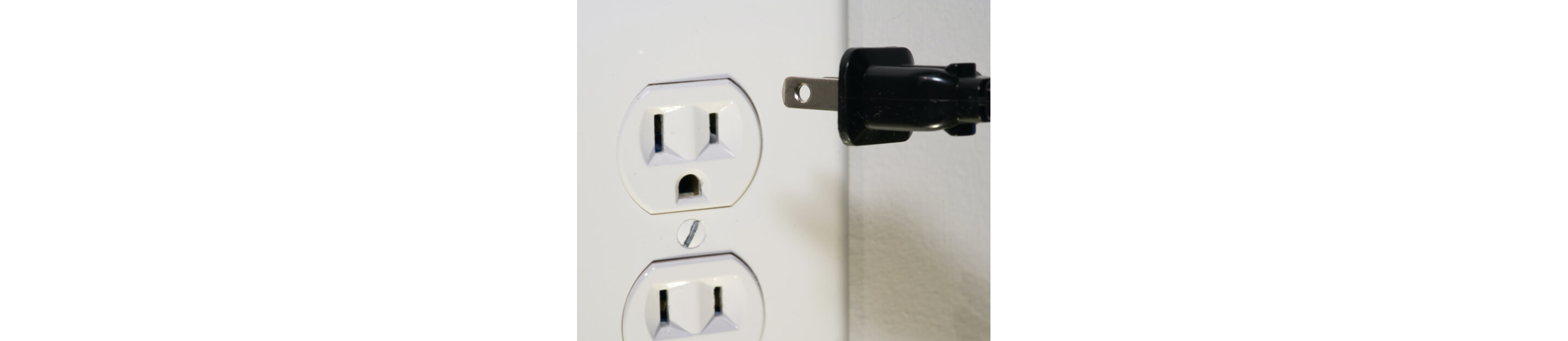 Power cord being unplugged from electrical outlet 