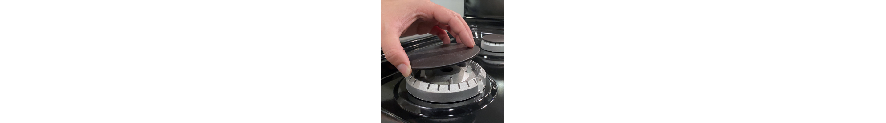 Placing burner cap back on burner