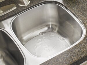 Kitchen sink with cleaner in it