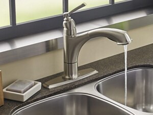 Kitchen sink with water running